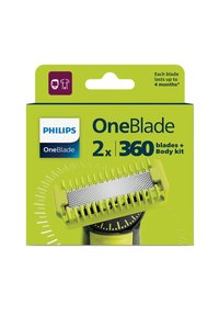 Lame di ricambio Philips OneBlade in una scatola verde. Presenta una protezione testurizzata con un motivo a griglia e un indicatore circolare nella parte inferiore.