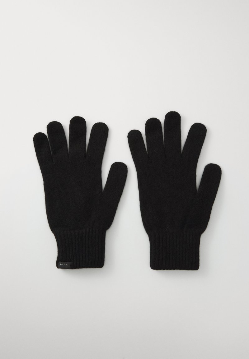 Luvas negras de malha com punho canelado, apresentando uma textura suave e design de cinco dedos, colocadas lado a lado sobre um fundo claro.