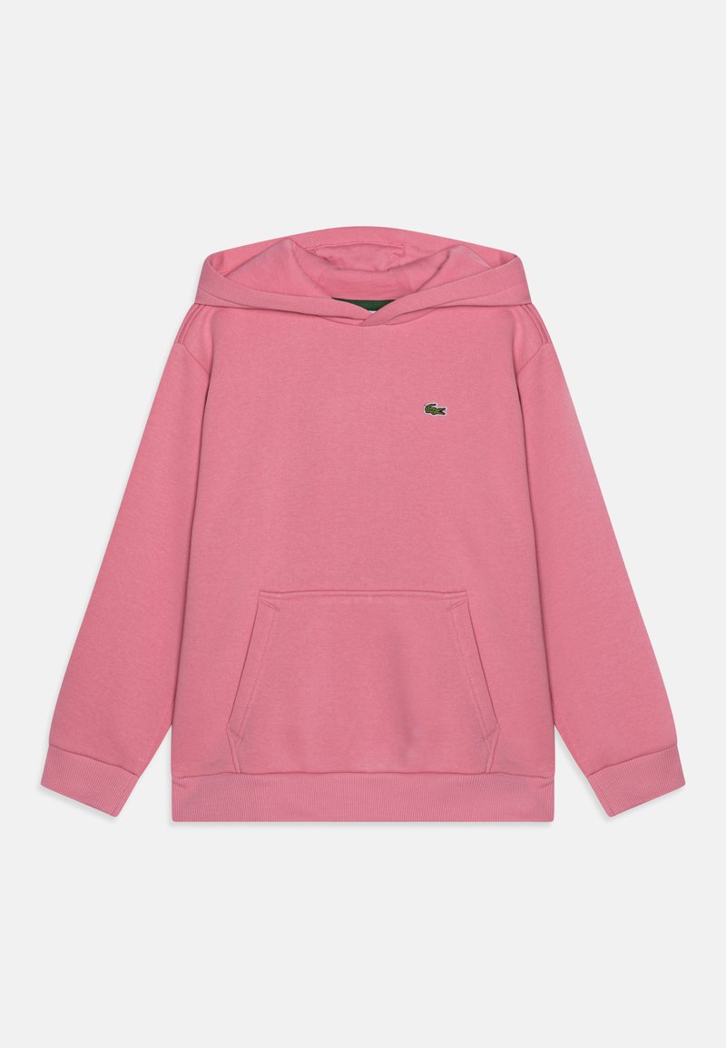 Rózsaszín kapucnis pulóver, puha anyagból készült. Kenguru zsebével és egy kis zöld logóval rendelkezik a mellkasán. Bordás mandzsetta és szegély jellemzi.