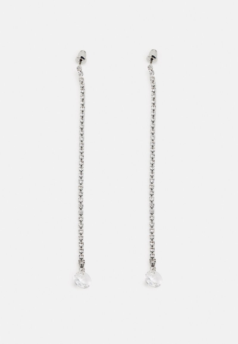 Longues boucles d'oreilles chaîne argentée avec de petits cristaux clairs et un cristal clair plus grand à chaque extrémité.
