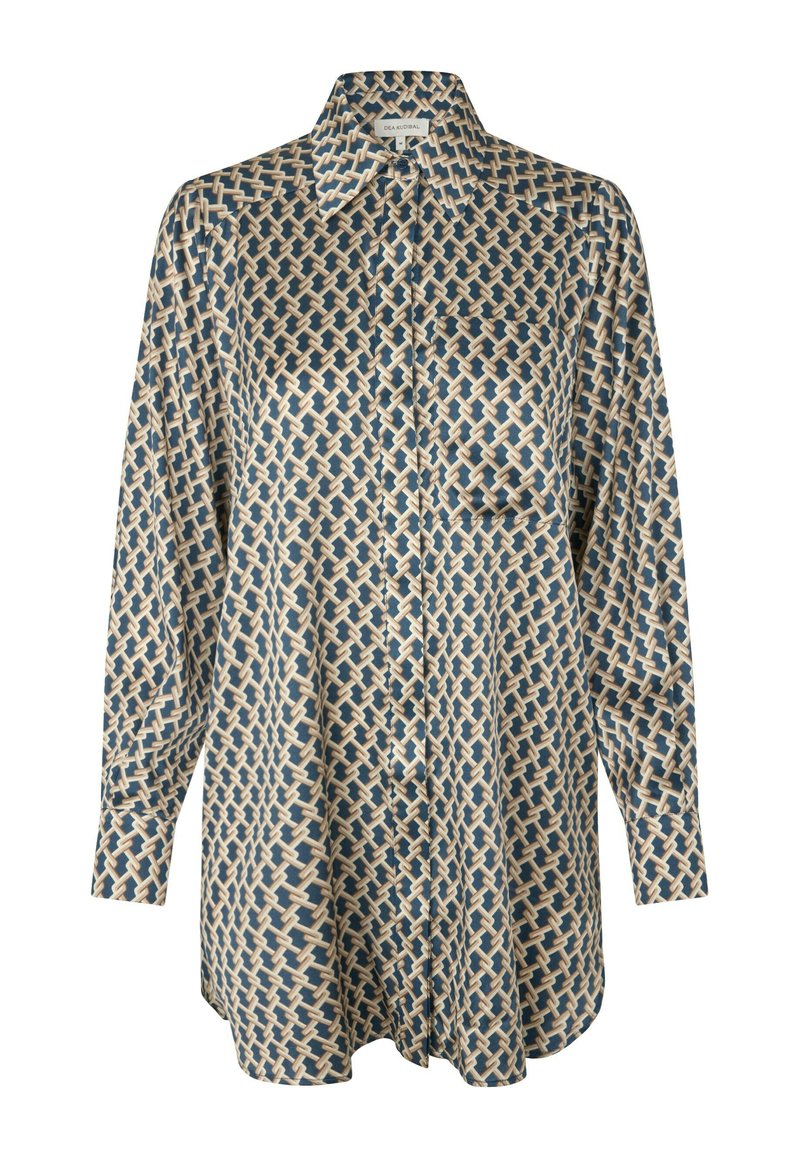 Chemise à manches longues boutonnée en bleu marine et crème avec motif tissé. Dotée d'un col et d'une poche poitrine unique. Texture de tissu lisse.