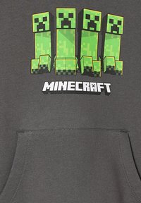 Grauer Hoodie mit vier grünen Blockfiguren und pixelierten Gesichtern. "MINECRAFT" ist in fetten weißen Buchstaben unter dem Design gedruckt.