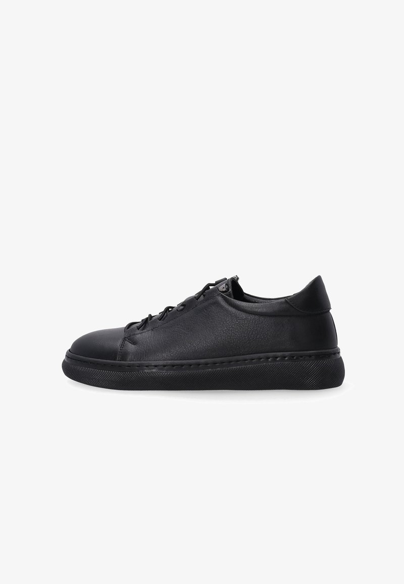 Black leather sneakers featuring a low-top design, rounded toe, and textured surface with subtle stitching and a rubber sole.