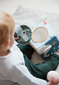 Soft fabric sensory cube featuring a blue ocean theme with animals, a round mirror, and colorful accents. Includes a plush round toy with an eye detail.