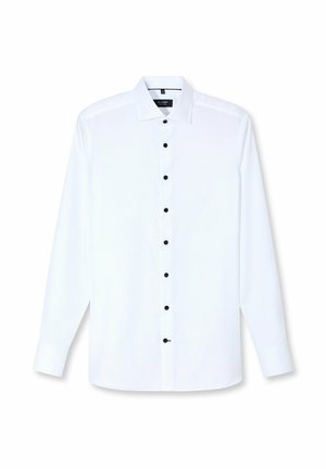 Witte blouse met lange mouwen van gladde stof. Voorzien van een klassieke kraag en zwarte knopen aan de voorkant en op de manchetten.