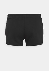 Pantaloncini di cotone neri con vita elasticizzata. Design semplice con una texture liscia e senza motivi o accessori visibili.