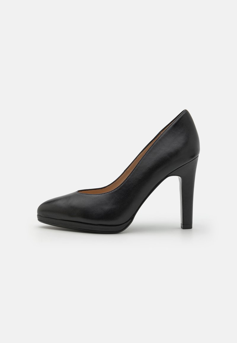 Black leather high-heeled pump featuring a pointed toe, smooth texture, and a sleek silhouette. Heel height approximately 10 cm.
