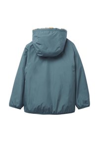 Giacca impermeabile color teal con cappuccio foderato in pelliccia, polsini elasticizzati e orlo regolabile con cordino. La parte posteriore presenta una texture liscia e opaca.