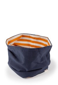 Navy fabric storage basket with an octagonal shape. Interior features alternating orange and white stripes. Soft texture, versatile use.