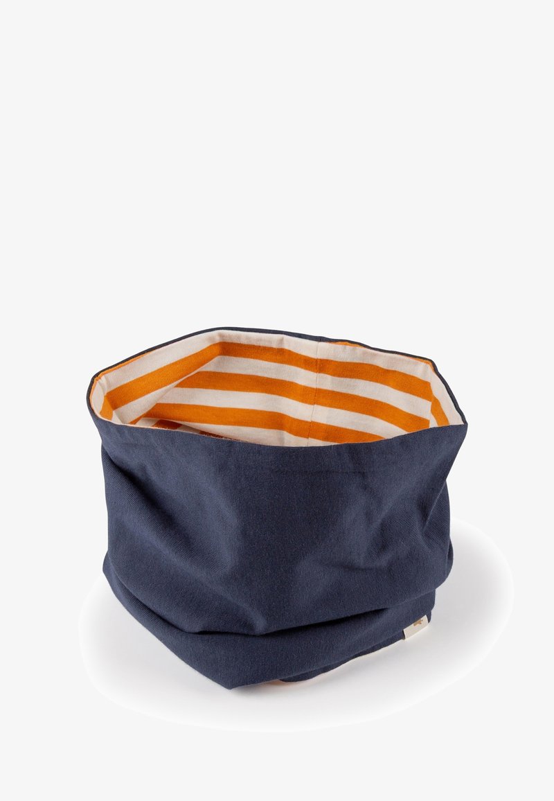 Navy fabric storage basket with an octagonal shape. Interior features alternating orange and white stripes. Soft texture, versatile use.