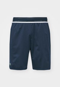 Námořnické sportovní šortky vyrobené z hladké, lehké látky. Elastický pas s kontrastním bílým pruhem a logem na zakončení.