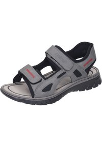 Gray sandal with adjustable Velcro straps, cushioned footbed, small mesh accents for breathability, and a textured rubber sole.