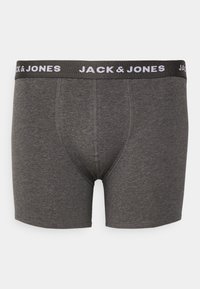 Graue Boxershorts aus weichem Baumwollmaterial. Mit einem schwarzen Bund, auf dem "JACK & JONES" in Weiß gedruckt ist. Glatte Textur, körpernahe Passform.