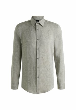Chemise à manches longues gris clair en tissu texturé, avec un devant à boutons, un col pointu et un ourlet arrondi.