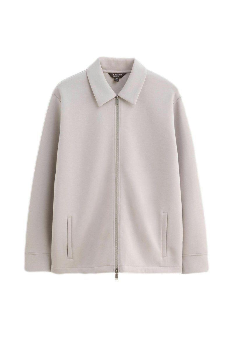 Light gray zip-up jacket with a collar and two vertical slit pockets, displayed against a white background.