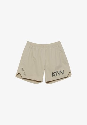 Beige lette shorts med elastisk talje, sidelommer og sort "ATW" logo på venstre ben samt lille tekst på højre ben.