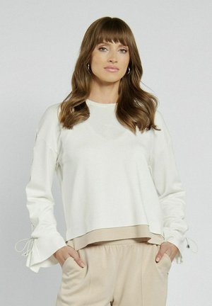 - Bluza