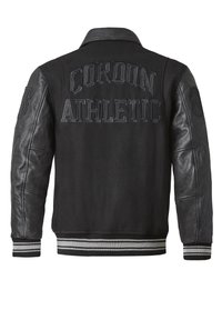 Black varsity jacket featuring wool body, leather sleeves, and striped ribbed cuffs. "CORDON ATHLETIC" printed on the back.