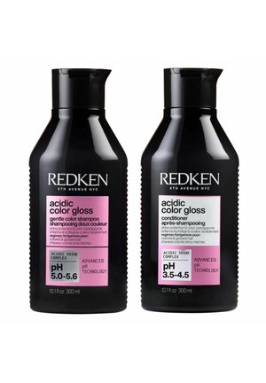 Two black Redken bottles labeled "acidic color gloss," shampoo pH 5.0-5.6 and conditioner pH 3.5-4.5, with pink and white labels.