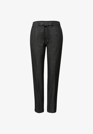 Pantalons de jogging noirs en tissu texturé. Avec une taille élastique munie d'un cordon de serrage, des jambes fuselées et des coutures latérales pour un détail supplémentaire.