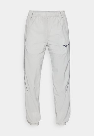 Light gray jogger pants made of smooth, synthetic fabric; features an elastic waistband, side pockets, and a small black logo.
