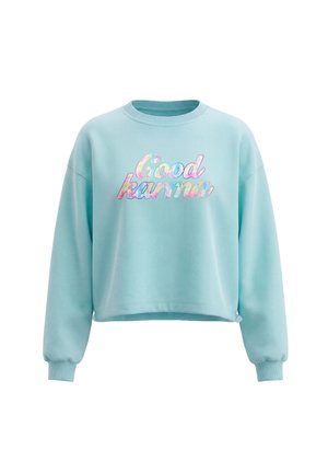 Lyseblå cropped sweatshirt med ribkanter og flerfarvet "Good karma" tekst i kursiv på fronten.