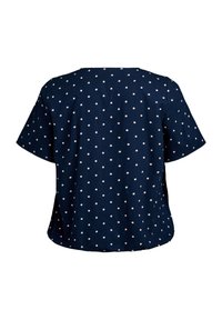 Blusa azzurra a maniche corte con pois bianchi, colletto rotondo e vestibilità morbida. Tessuto morbido con una superficie liscia.