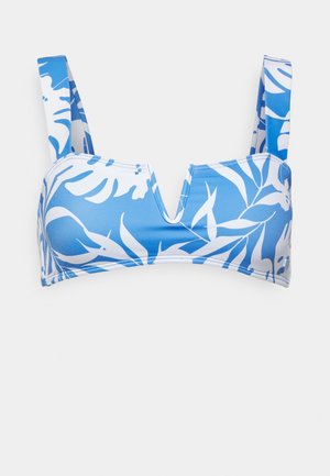 Top de biquíni azul e branco com padrão de folhas, apresentando alças largas, decote em V e tecido liso e elástico.