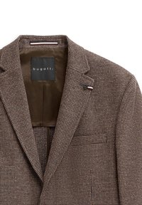 Brauner Tweed-Blazer mit strukturiertem Muster, Reverskragen und einer Ein-Knopf-Verschluss. Innenfutter ist in einheitlichem Braun. Markenlabel sichtbar.