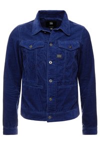 Blå manchesterjacka med knappstängning framtill, två bröstfickor med klaffar, sidofickor med sprund och en spetsig krage.