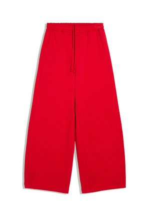 Pantalon large rouge vif avec taille élastique et cordon de serrage, avec poches latérales et ourlet droit.