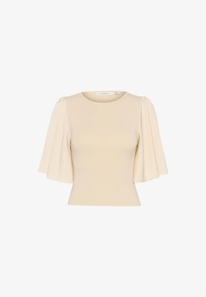 Top color crema realizzato in un tessuto morbido, con maniche corte e svolazzanti e un colletto rotondo. Design semplice e aderente senza motivi.