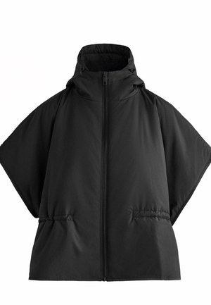 Veste matelassée noire surdimensionnée avec un col montant, une fermeture éclair et des poches latérales. Réalisée en tissu doux et lisse avec une finition mate.