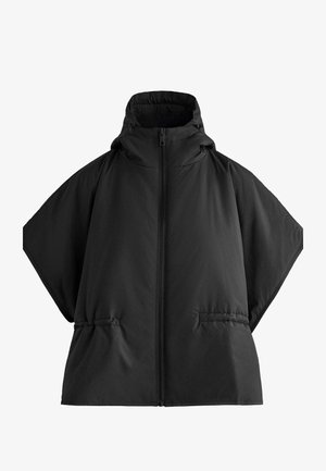 Veste matelassée noire surdimensionnée avec un col montant, une fermeture éclair et des poches latérales. Réalisée en tissu doux et lisse avec une finition mate.