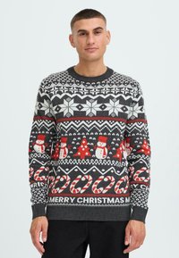 Gray knit Christmas sweater featuring holiday patterns in red and white, including snowmen, candy canes, and "MERRY CHRISTMAS" text.