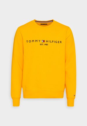 Yellow sweatshirt made of cotton, featuring "TOMMY HILFIGER EST. 1985" in black text, round neck, and ribbed cuffs with logo detail.
