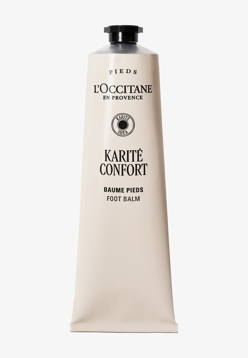 Tube de baume pour les pieds Karité Confort de L'Occitane en Provence avec un bouchon noir sur fond blanc.