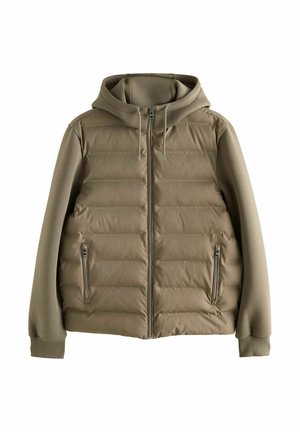 Puffjacka i olivgrön färg med dragkedja fram, avtagbar huva, elastiska ärmslut och två sidofickor med dragkedja i en mjuk textur.