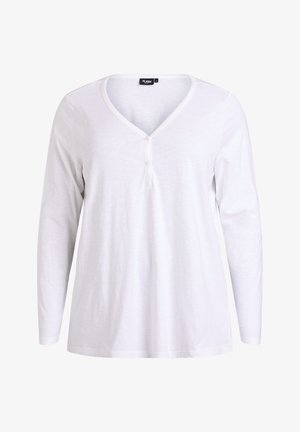 Biała koszulka z długim rękawem, dekoltem w serek i trzema guzikami przy szyi. Wykonana z miękkiego, lekkiego materiału o gładkiej fakturze.