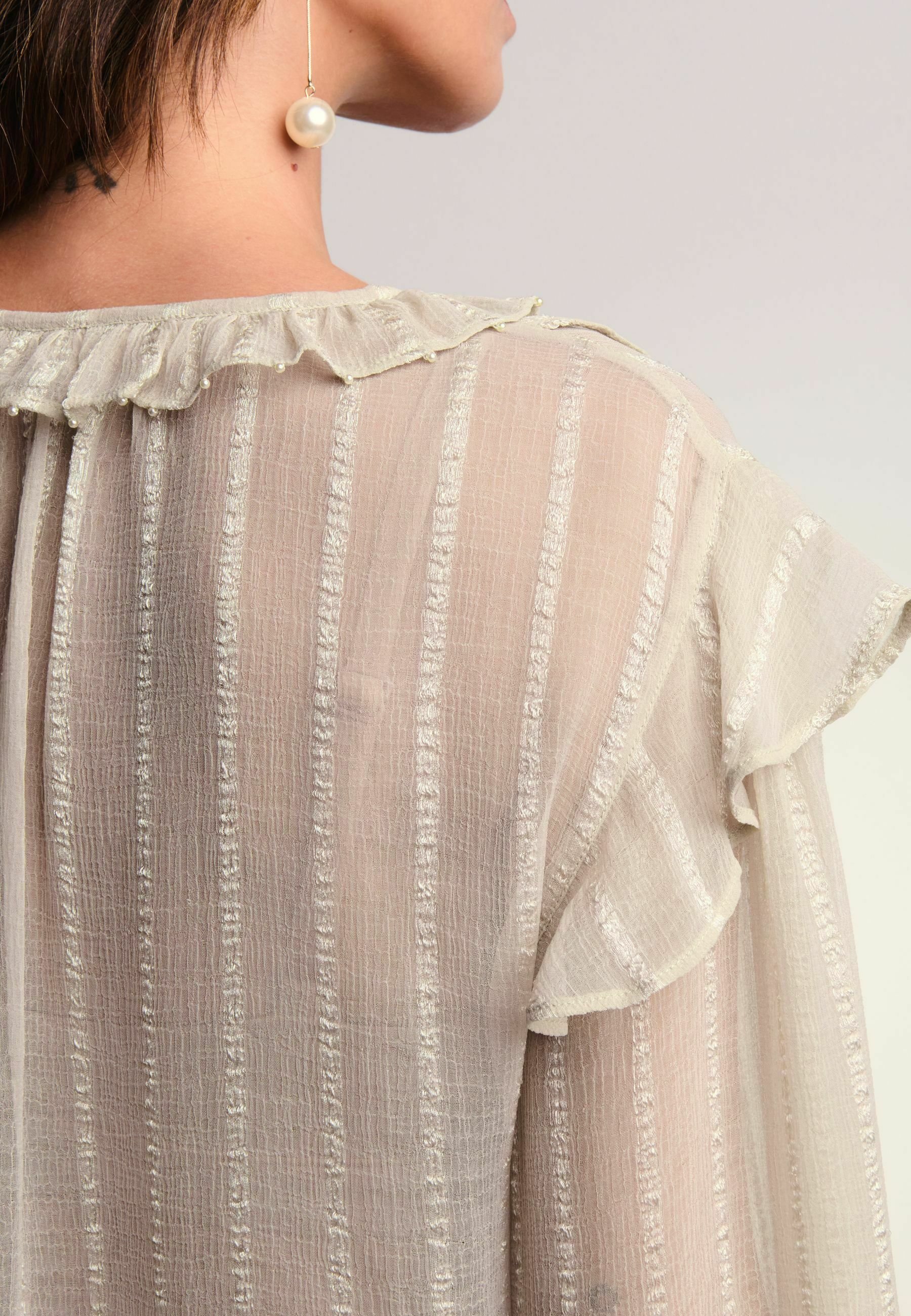 beige ruffle blouse