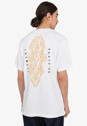 White t-shirt featuring a large yellow graphic design on the back, with "Element Skate Co." printed vertically alongside. Short sleeves and round neck.