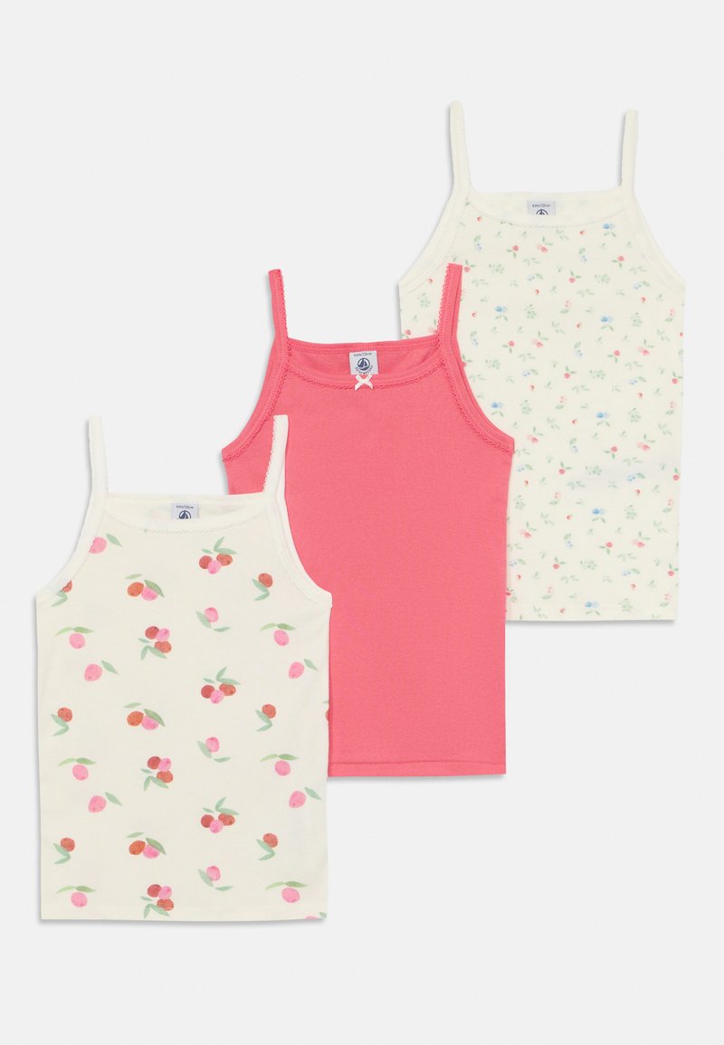 Trīs kamzolas: viena rozā, viena balta ar mazu ziedu rakstu, viena krēma krāsā ar ķiršu rakstu. Izgatavotas no mīksta auduma, ar regulējamām siksniņām.