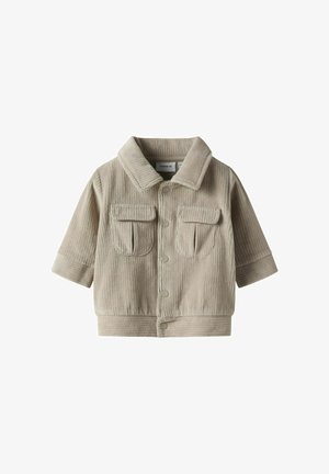 Beige kordfløyelsjakke med knapper foran, korte ermer, to brystlommer, og ribbede mansjetter. Teksturert stoff med vertikale linjer.