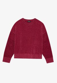 Pull en tricot rouge avec un col rond côtelé et des manches longues. Le tissu présente une finition texturée et une bordure raccourcie.