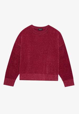 Röd stickad tröja med ribbad rund halsringning och långa ärmar. Tyget har en texturerad yta och en kortad nederkant.