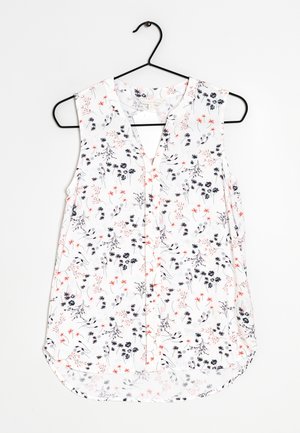Floral sleeveless blouse with a V-neckline, featuring a white background, black and red flower patterns, and a curved hemline.