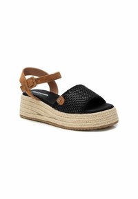 Sandal plataforma de esparto tejido negro con correa de ante marrón, entre suela de cuerda de yute, diseño de punta abierta y sutil acento de logo.