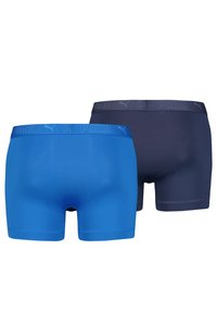 Two pairs of men’s boxer briefs: one in blue and the other in dark gray, featuring elastic waistbands with "PUMA" branding and snug fit.