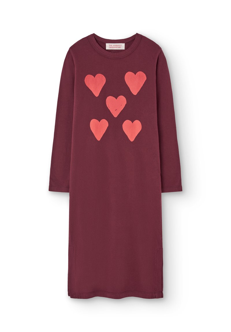 Bordeaux-rotes Kleid mit langen Ärmeln, das auf der Vorderseite fünf rosa Herzformen aufweist. Hergestellt aus weicher Baumwolle, mit seitlichen Taschen und einer lockeren Passform.
