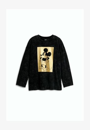Crna majica s dugim rukavima s žutim pravokutnim otiskom Mickeyja Mousea koji stoji s rukama na bokovima sprijeda.